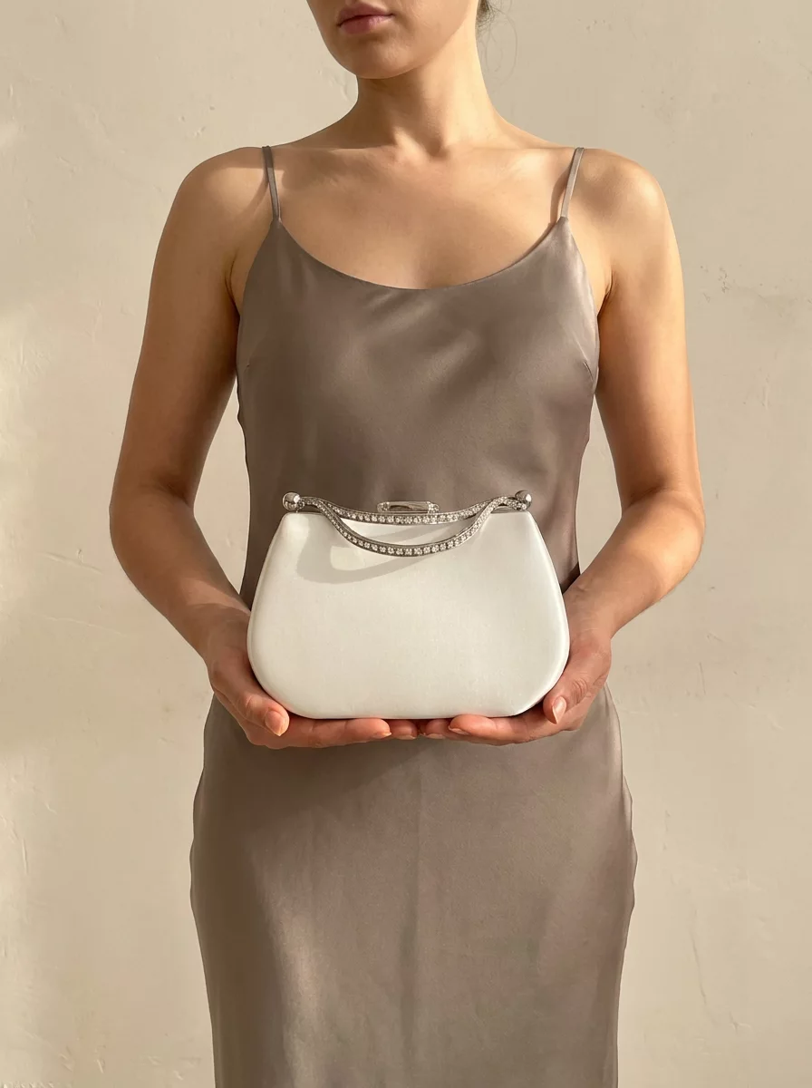 Ivory satin bridal clutch with rhinestone handle