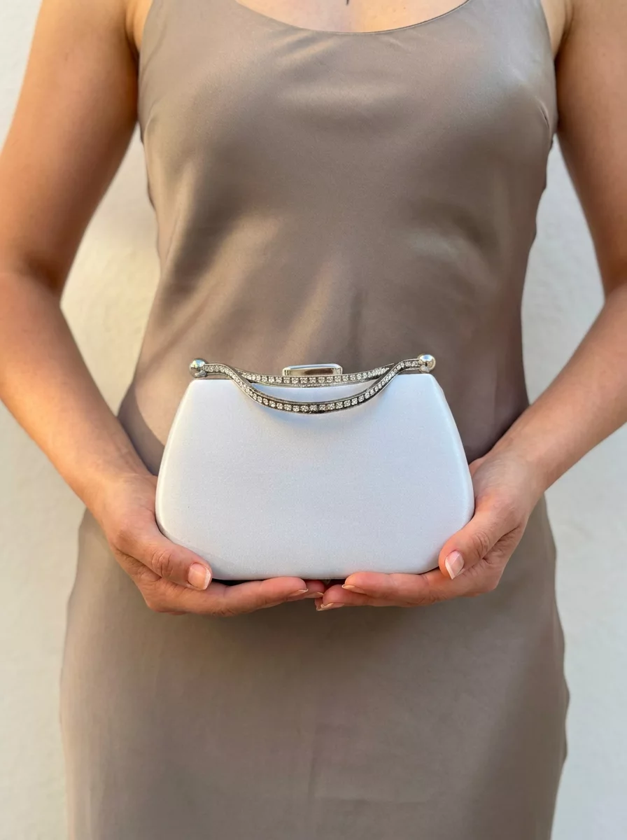 Silver satin wedding clutch with rhinestone handle